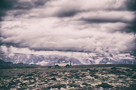 white truck on gray road during daytime thumbnail