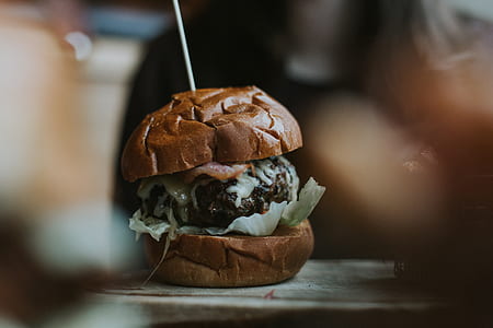 shallow focus photography of hamburger on table thumbnail
