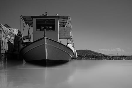 gray scale of boat on dock thumbnail
