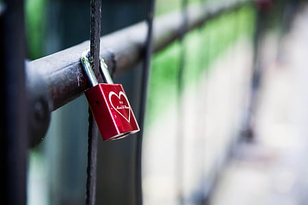 shallow focus of red and silver padlock thumbnail