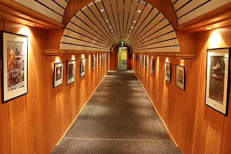 empty hallway between photo frames on wall thumbnail