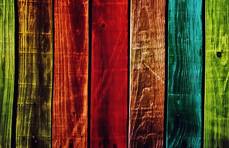 red, blue, and lime-green wooden fence thumbnail