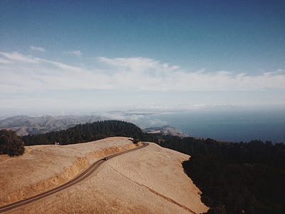 aerial photography of concrete road and trees thumbnail
