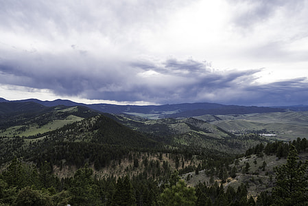 Hills landscape under heavy clouds in Helena thumbnail