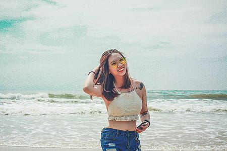 woman wearing crop top beside the seashore thumbnail