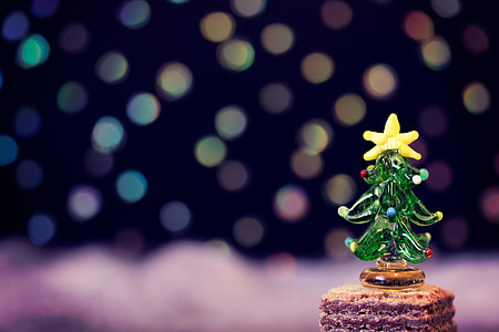 tilt shift lens photography of christmas tree glass figurine thumbnail