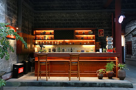 two brown wooden bar stool chairs thumbnail