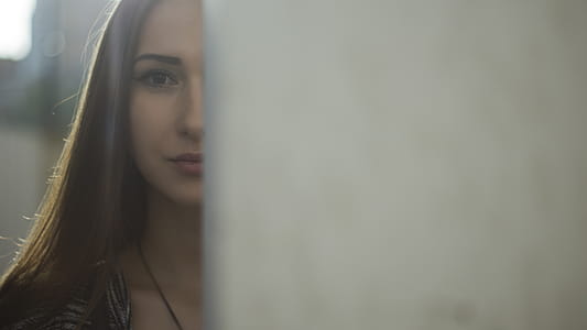 Woman With Brown Hair Near White Painted Wall thumbnail
