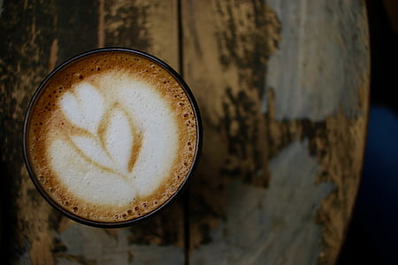 selective focus photo of a black mug filled with coffee thumbnail