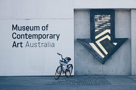 blue bicycle near wall thumbnail