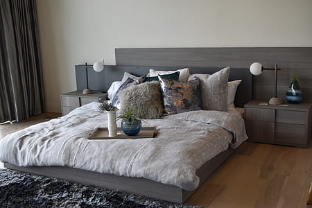 gray wooden bed beside of nightstand thumbnail
