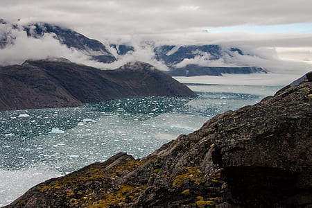 mountain covered with snow and sea view thumbnail