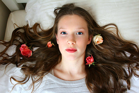 woman in grey shirt lying in bed thumbnail