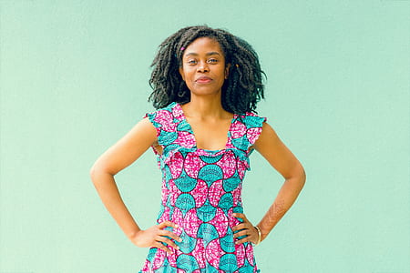 woman in teal and pink sleeveless dress thumbnail