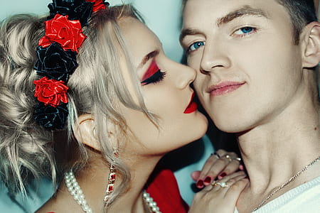 woman kissing man photo thumbnail