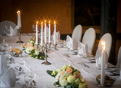 white table arrangement with lighted candles thumbnail