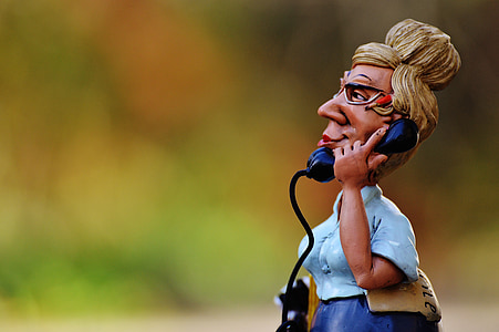 woman holding telephone bobble-head thumbnail