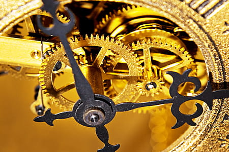 gold-colored and black skeleton clock thumbnail