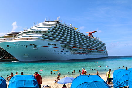 white cruiser ship placed on sea under clear blue sky thumbnail