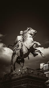 Man Holding Axe Rides On Horse Concrete Statue thumbnail