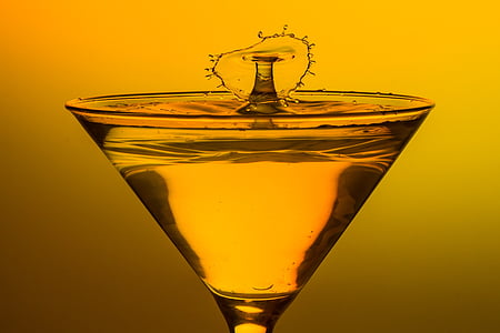 cocktail glass filled with clear liquid thumbnail