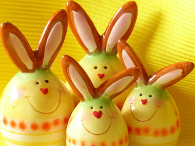 four yellow-and-brown ceramic rabbit figurines thumbnail