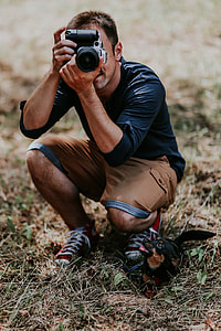 Photographer taking photos of a beautiful, young woman thumbnail