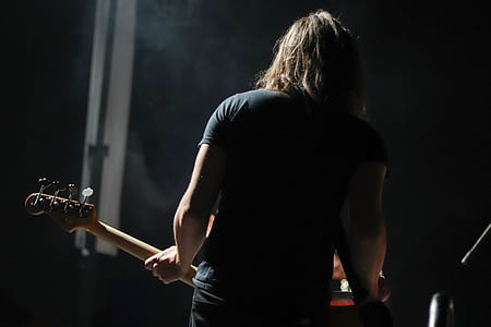 man in black shirt playing guitar thumbnail