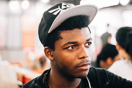 selective focus photo of man looking sideways thumbnail