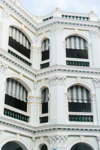 low angle photo of white concrete building thumbnail