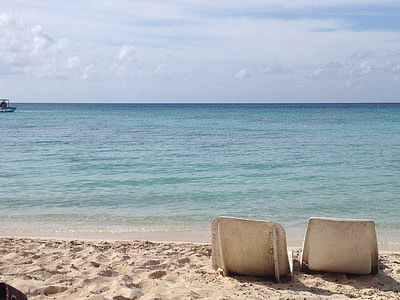 lounge chairs on beach shore thumbnail
