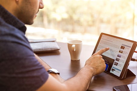 person pointing black tablet computer thumbnail