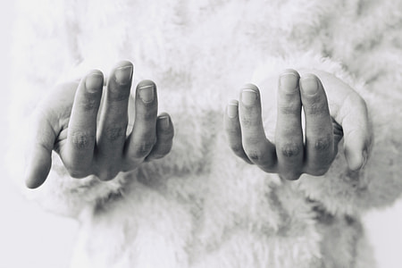 grayscale photo of two hands thumbnail