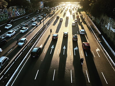 panning photo of cars on road thumbnail