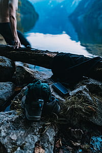 shoes beside smartphone on top of rock thumbnail