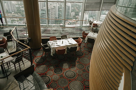 dining table with chairs near window thumbnail
