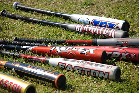 assorted steel baseball bats on ground thumbnail