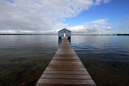 brown wooden boats dock over the horizon during daytime thumbnail