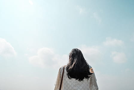 person wearing white top under blue sky thumbnail