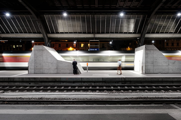 person standing on train station