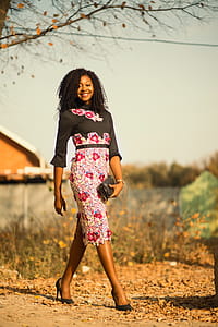 Woman Walking While Holding Bag thumbnail