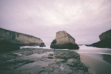 gray rocky mountain on seashore thumbnail