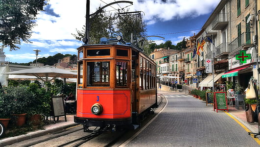 yellow and orange train on railway thumbnail
