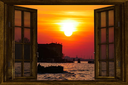 beige wooden frame 8-lite window near ocean over silhouette of building at sunset thumbnail