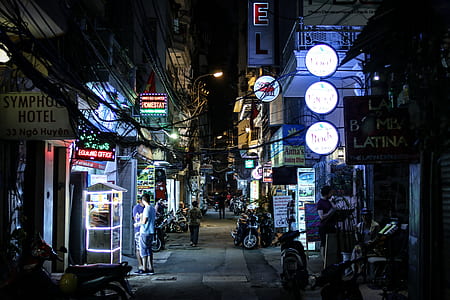 photo of people standing on alley near building thumbnail