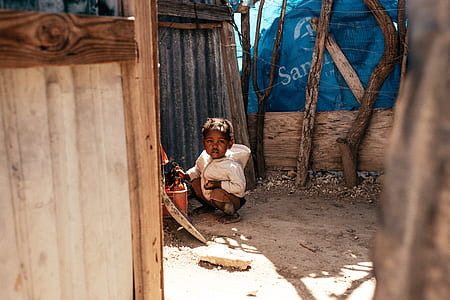 child near galvanized sheet thumbnail