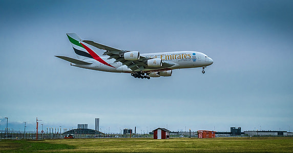 green and white airplane thumbnail