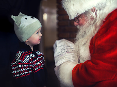 Santa talking with a young child thumbnail