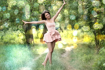 woman in pink halter dress outside house thumbnail