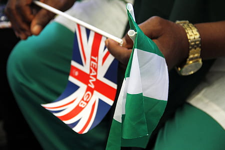 person holding flag of Union Jack thumbnail